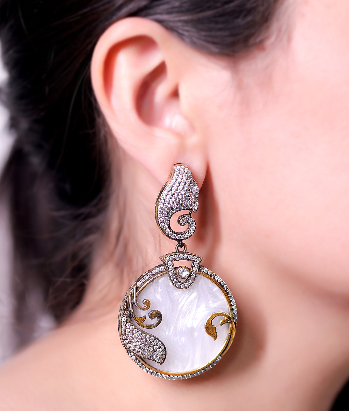 GAVI® Textured White Stone and Alloy Double Tone Dangler earrings with Nano Set American Diamonds for that Chic ethnic look.