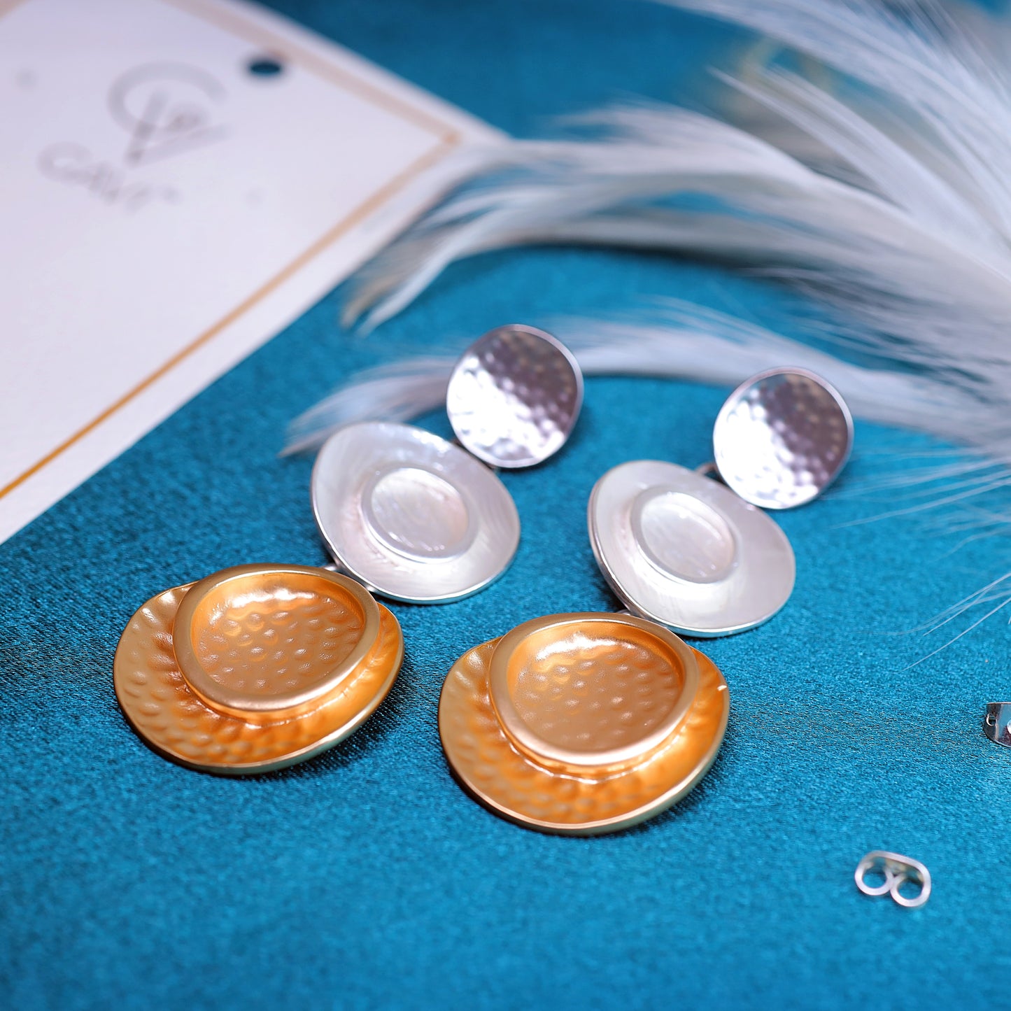 GAVI® Stainless Steel Dual-Tone danglers to add a touch of Modernity and Class to your ensemble.