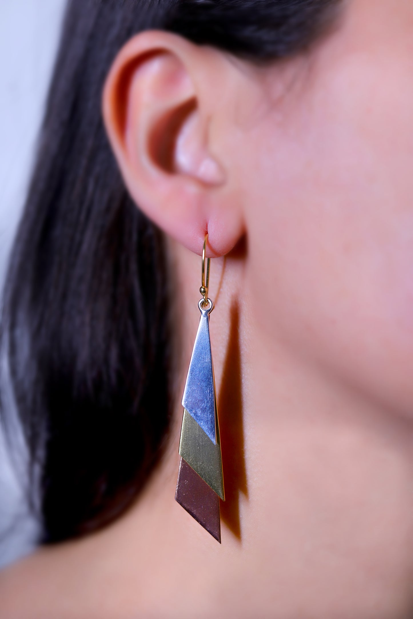 GAVI® Distinctive Three Tone Brass Danglers to Set You Apart.
